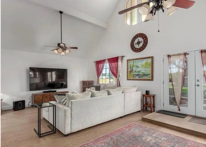 Bright living room with ceiling fans